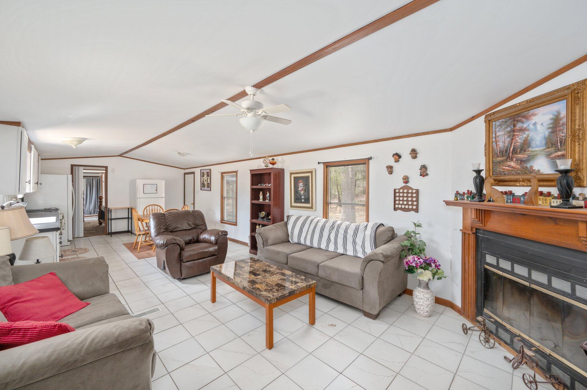 4507 Rainbird Rise Road Crestview, FL 32539 - Photo 7 of 33 a living room with furniture and a flat screen tv