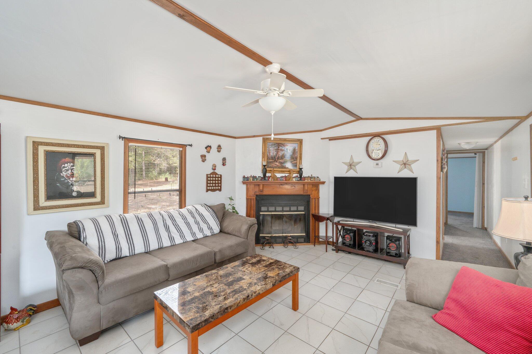 4507 Rainbird Rise Road Crestview, FL 32539 - Photo 8 of 33 a living room with furniture and a flat screen tv