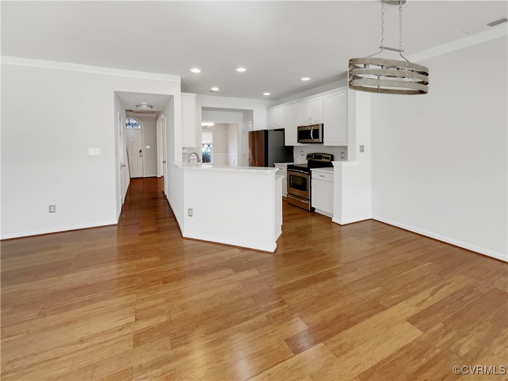 6385 Eagles Crest Lane Chesterfield, VA 23832 - Photo 11 of 24 a view of kitchen with cabinets appliances and wooden floor