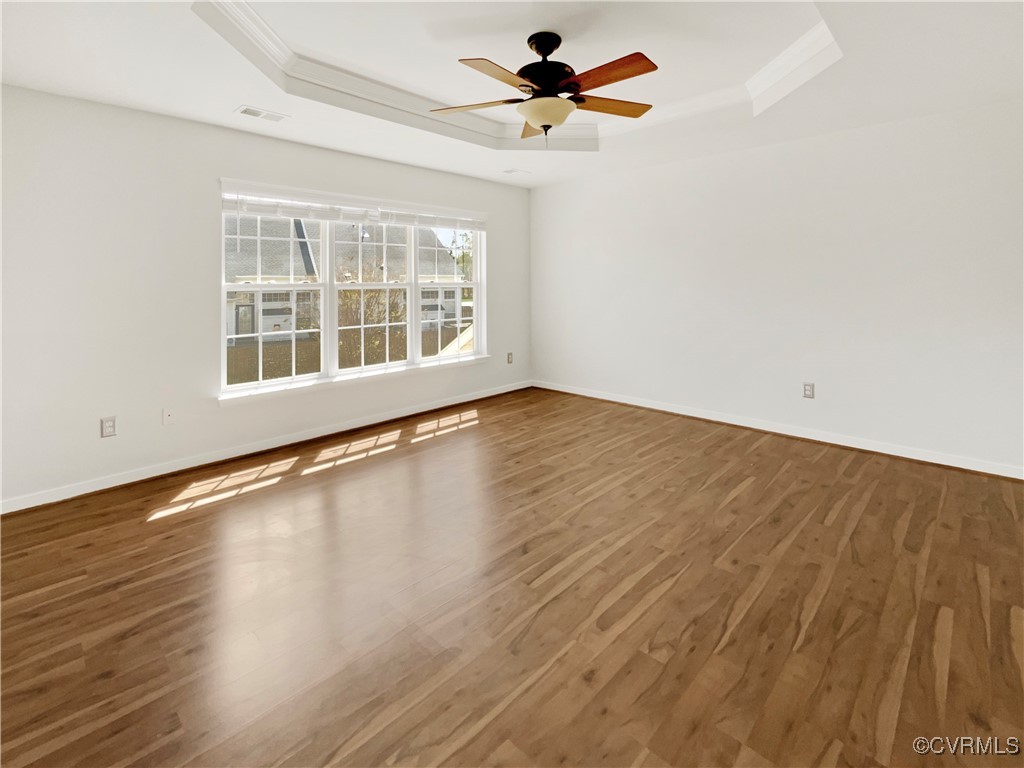 6385 Eagles Crest Lane Chesterfield, VA 23832 - Photo 19 of 24 an empty room with wooden floor fan and windows