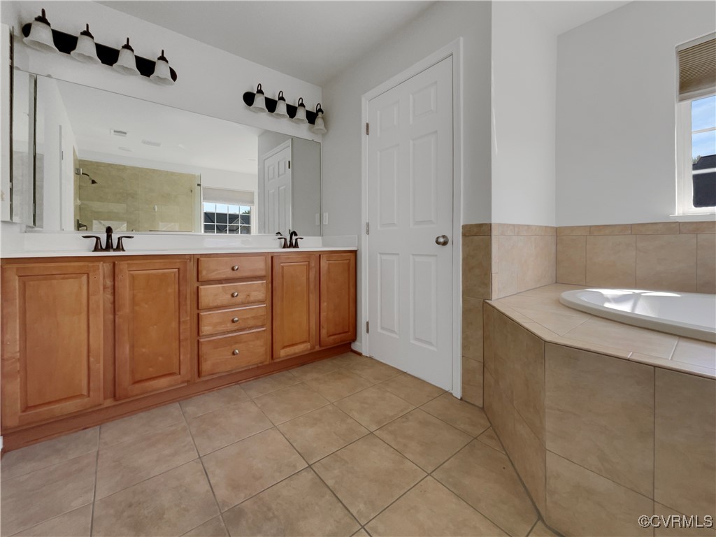 6385 Eagles Crest Lane Chesterfield, VA 23832 - Photo 22 of 24 a spacious bathroom with a tub sink and mirror