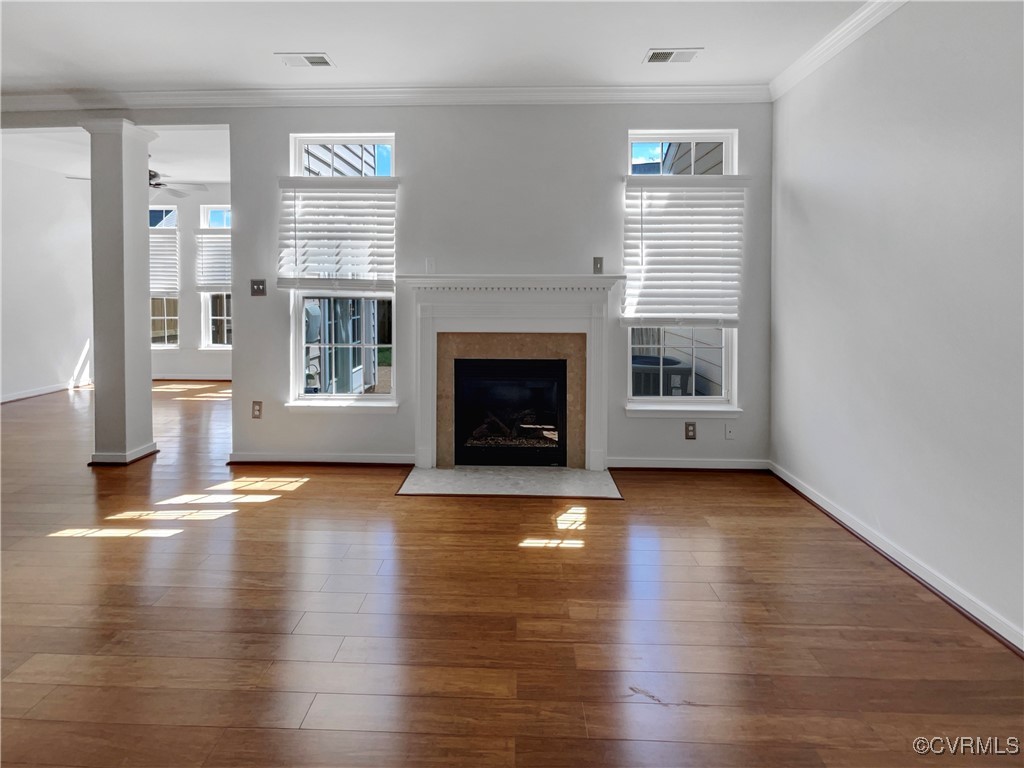 6385 Eagles Crest Lane Chesterfield, VA 23832 - Photo 3 of 24 a view of a livingroom with wooden floor and a fireplace