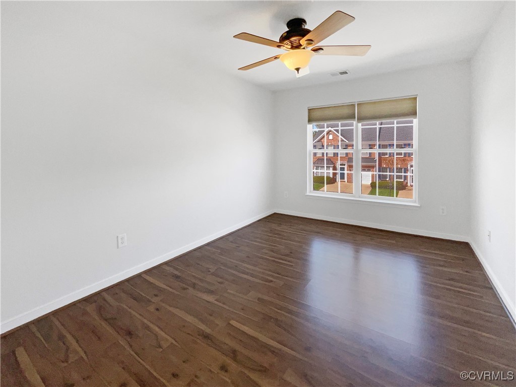 6385 Eagles Crest Lane Chesterfield, VA 23832 - Photo 5 of 24 a view of an empty room with wooden floor and a window