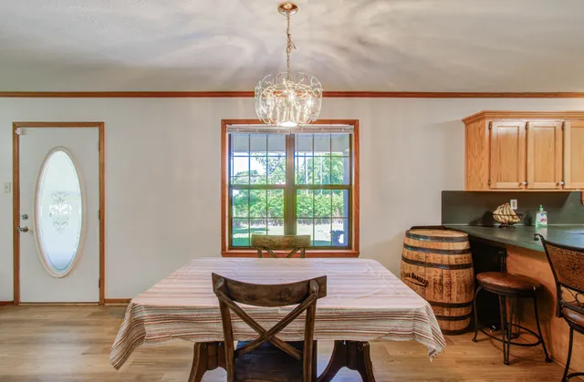 a dining room with furniture and window
