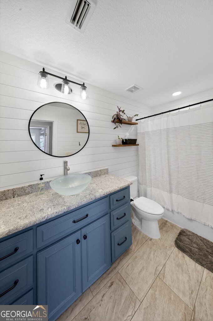 15 Ruger Circle Lakeland, GA 31635 - Photo 26 of 31 a bathroom with a granite countertop sink mirror and toilet