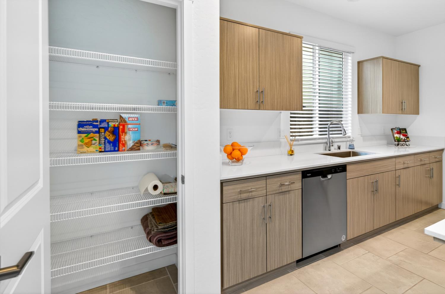 317 Talus Way South Madera, CA 93636 - Photo 21 of 61 a utility room with stainless steel appliances cabinets and window