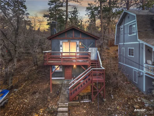 a view of a house with a small yard