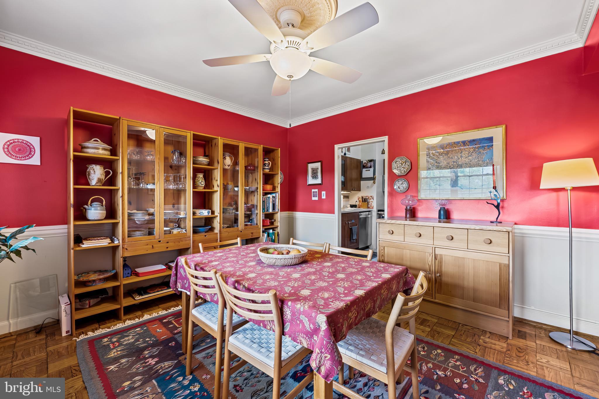 3601 Greenway, Unit 705 Baltimore, MD 21218 - Photo 9 of 30 a view of a dining room with furniture and chandelier
