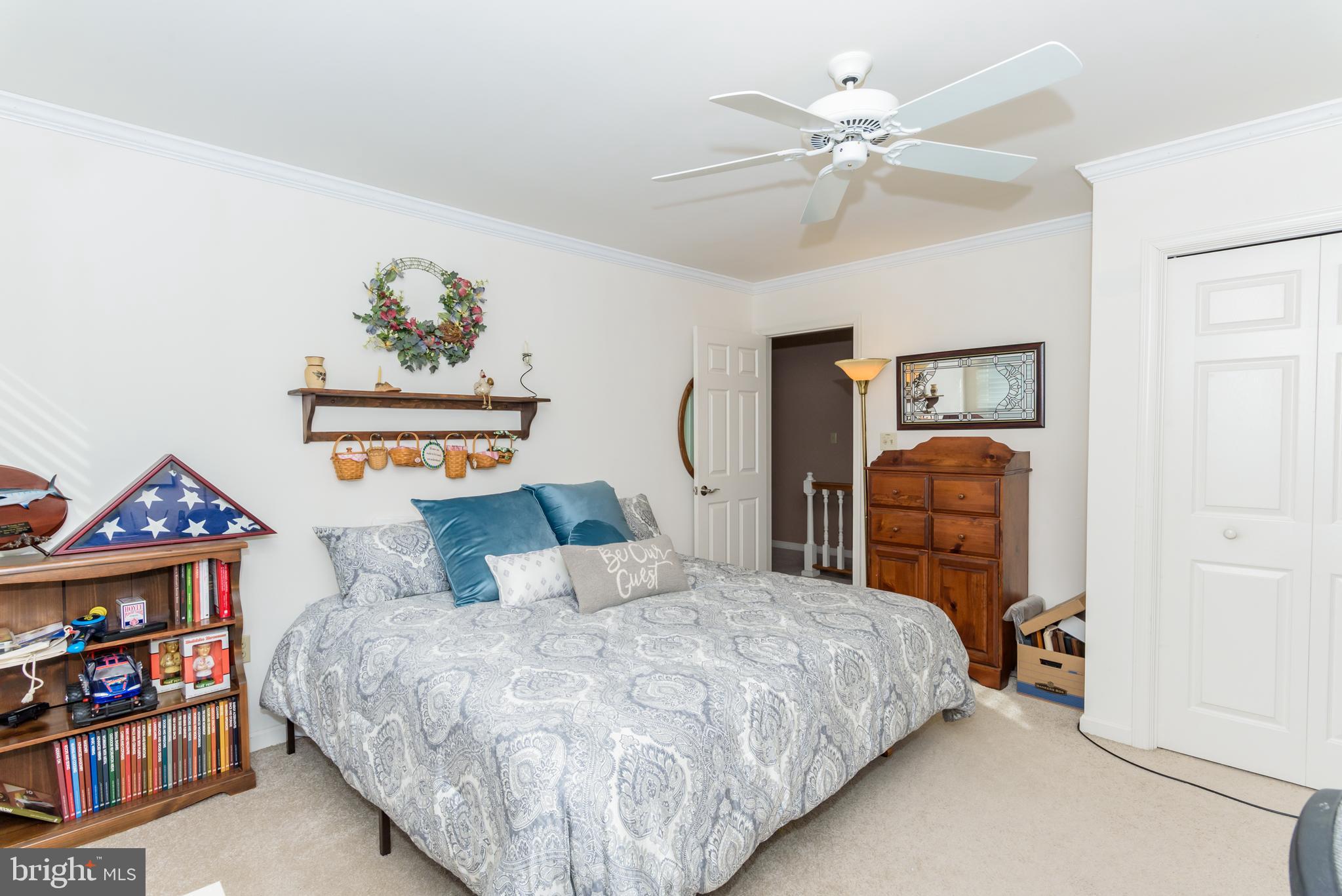 11 Drawbridge Road Berlin, MD 21811 - Photo 50 of 78 a bedroom with a bed and a chandelier