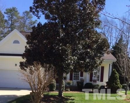 7908 Milltrace Run Raleigh, NC 27615 - Photo 1 of 20 a view of a white house with a big yard and large tree