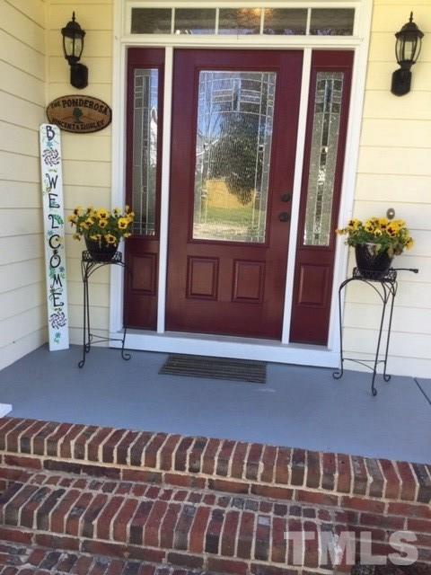 7908 Milltrace Run Raleigh, NC 27615 - Photo 5 of 20 a view of a balcony and chair