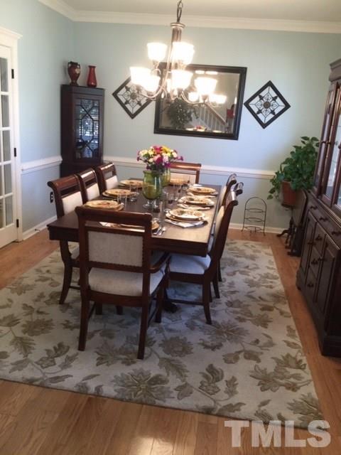 7908 Milltrace Run Raleigh, NC 27615 - Photo 9 of 20 a view of a dining room with furniture