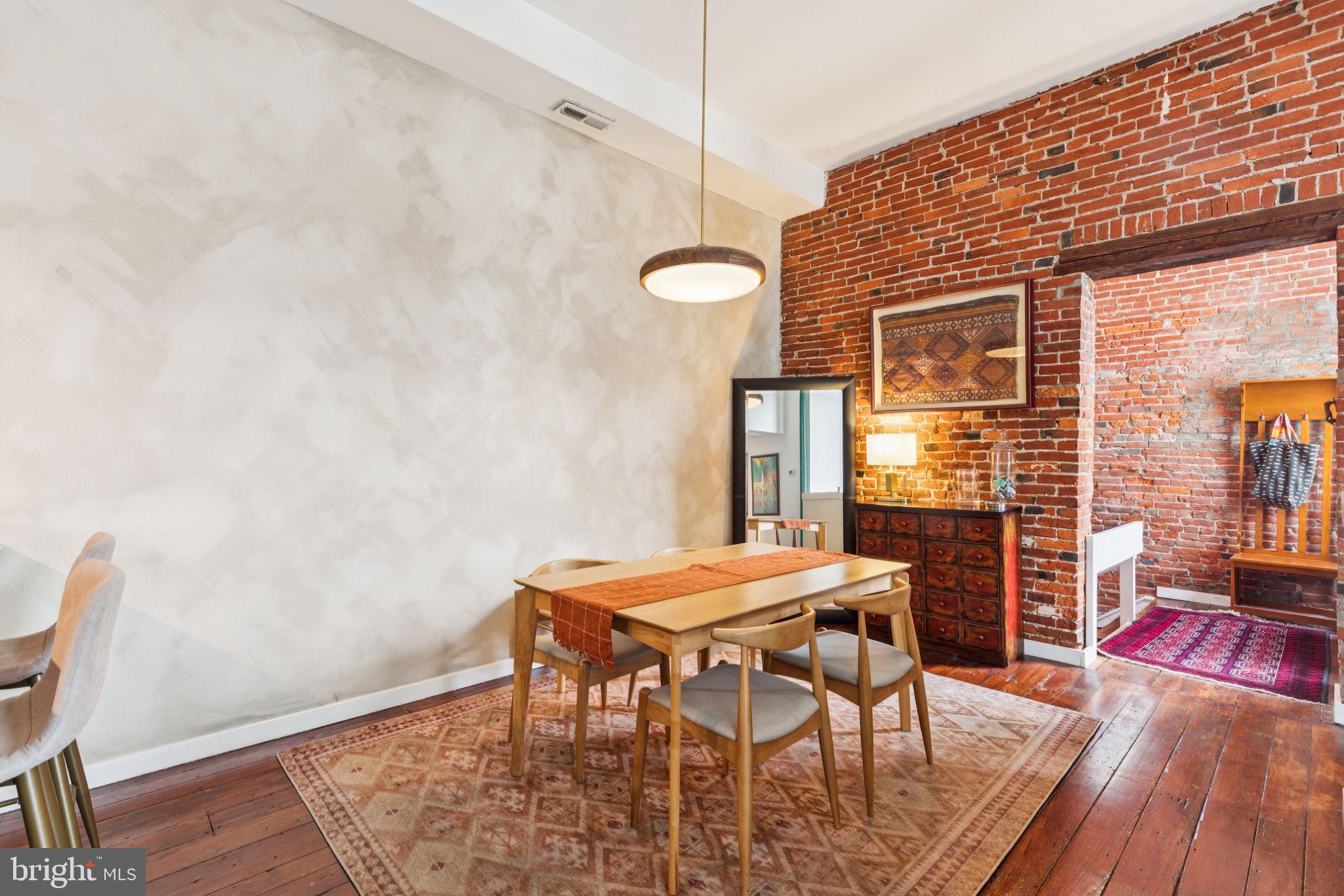 765 South 2nd Street, Unit G Philadelphia, PA 19147 - Photo 14 of 31 a view of a dining room with furniture and wooden floor
