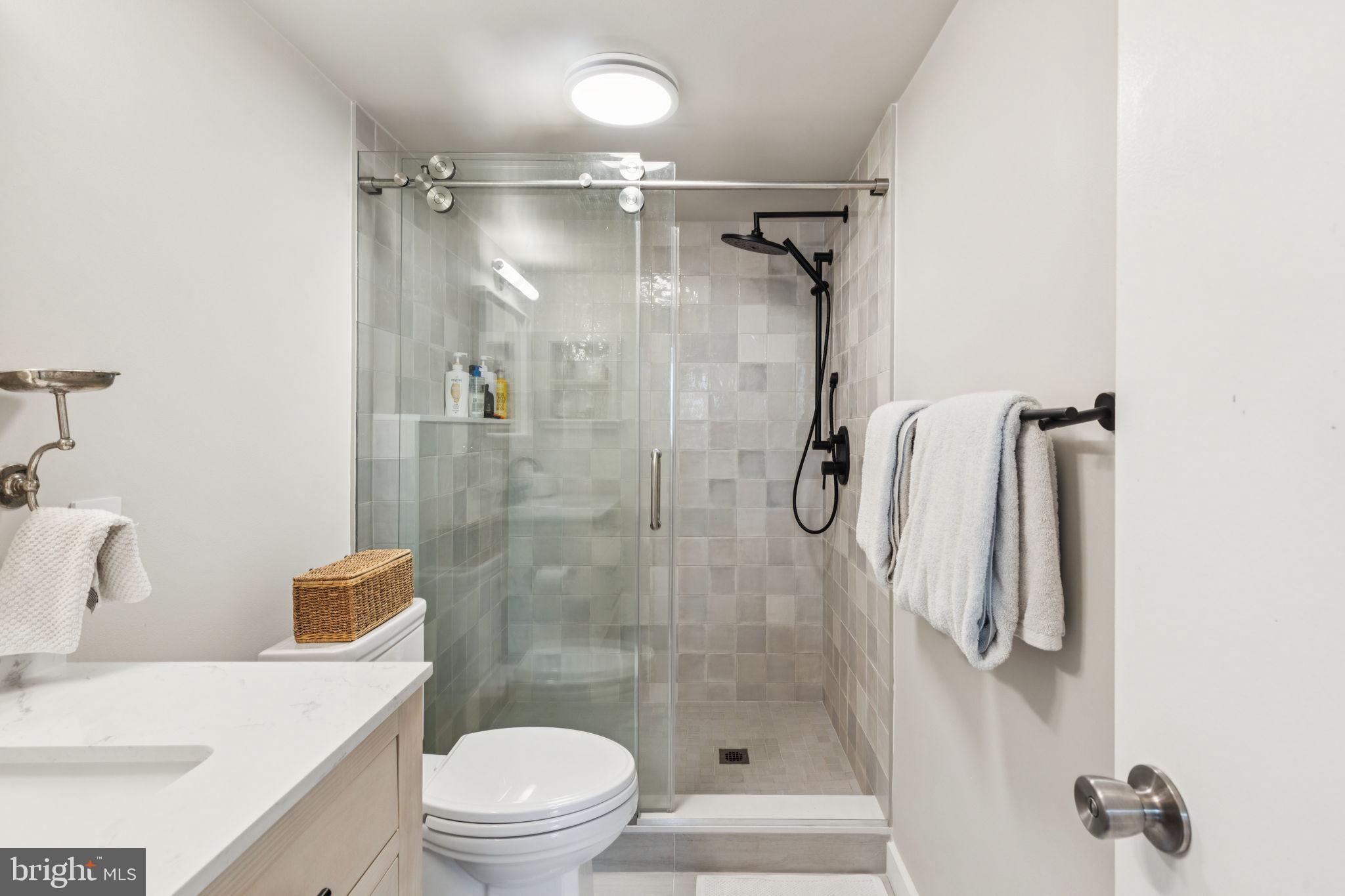 765 South 2nd Street, Unit G Philadelphia, PA 19147 - Photo 24 of 31 a bathroom with a shower toilet and sink