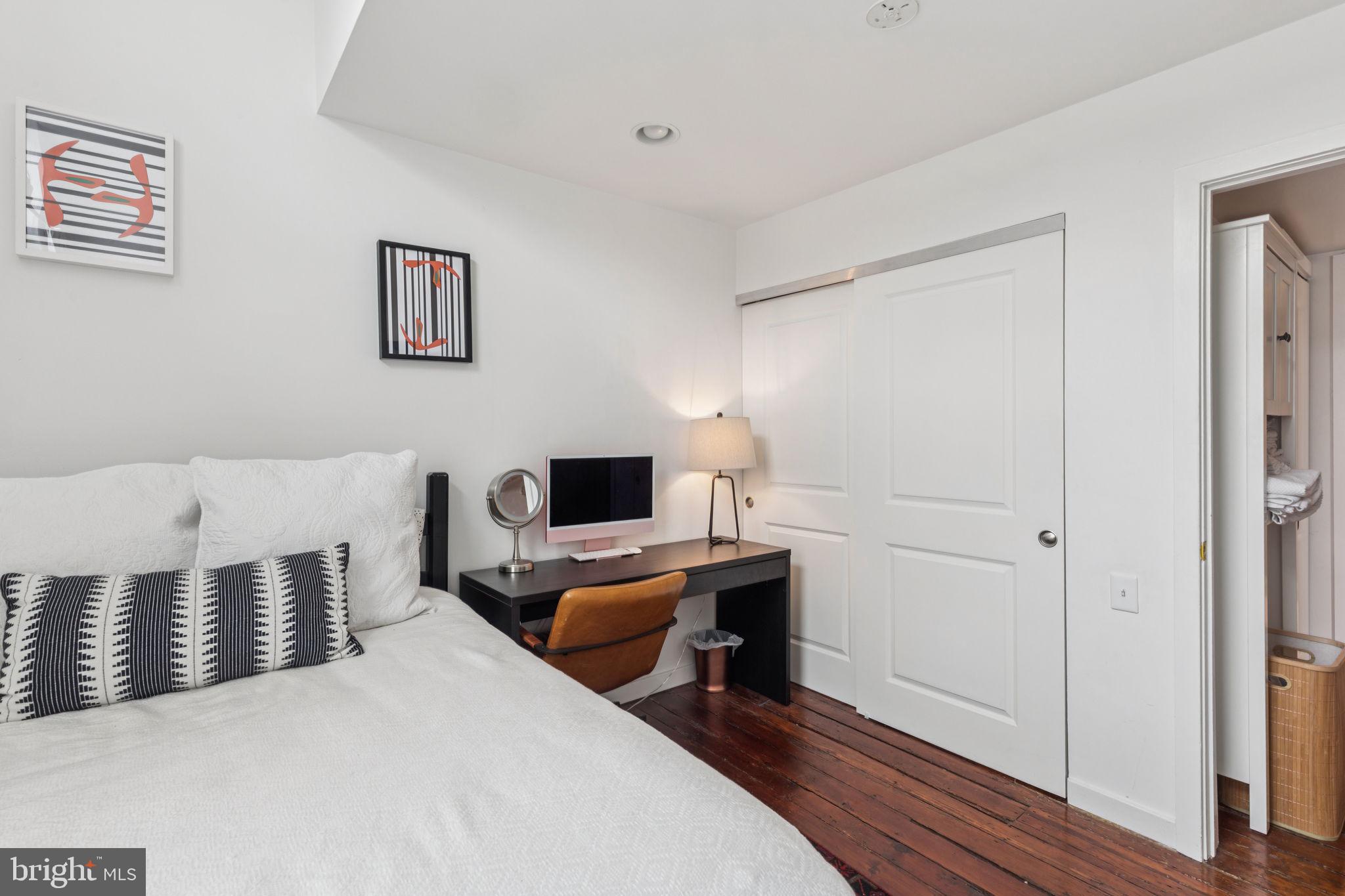 765 South 2nd Street, Unit G Philadelphia, PA 19147 - Photo 26 of 31 a bedroom with a bed and a desk