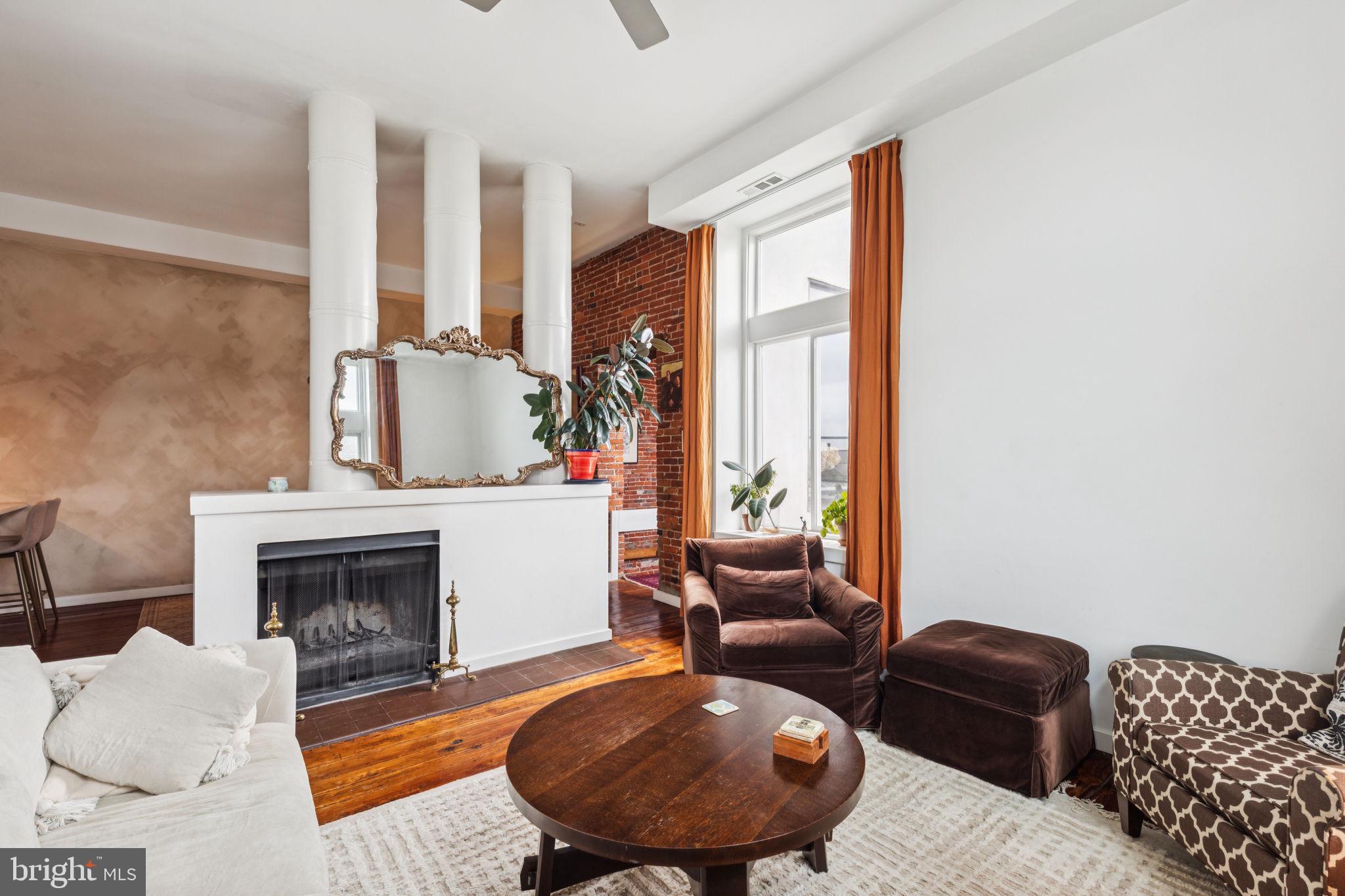 765 South 2nd Street, Unit G Philadelphia, PA 19147 - Photo 6 of 31 a living room with furniture fireplace and a large window