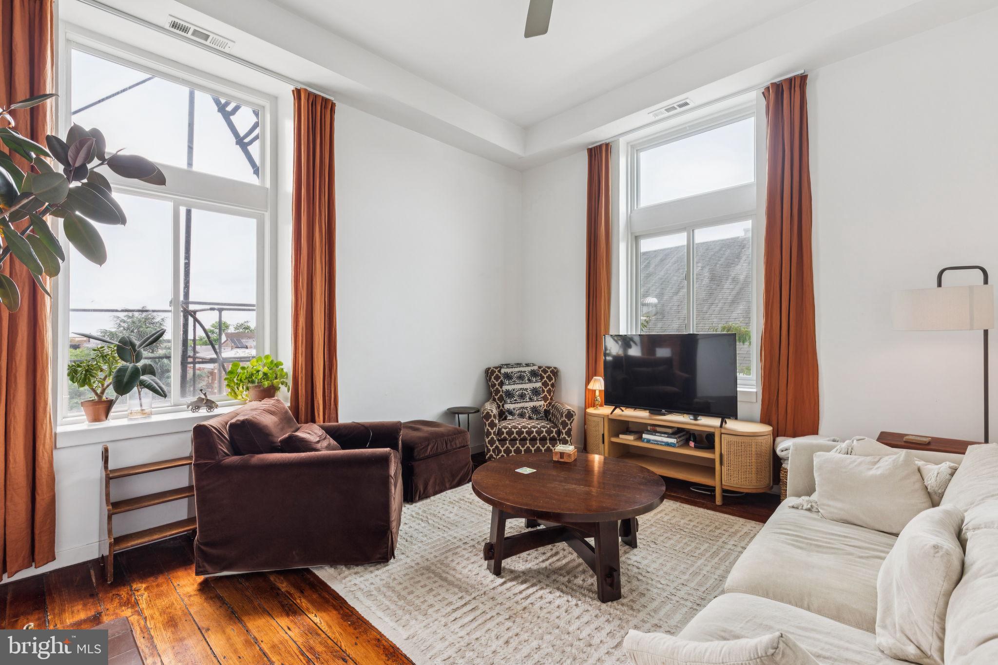 765 South 2nd Street, Unit G Philadelphia, PA 19147 - Photo 8 of 31 a living room with furniture fireplace and a large window