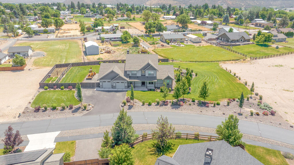344 Northwest Saddle Ridge Loop Prineville, OR 97754 - Photo 13 of 64 an aerial view of residential houses with outdoor space and river