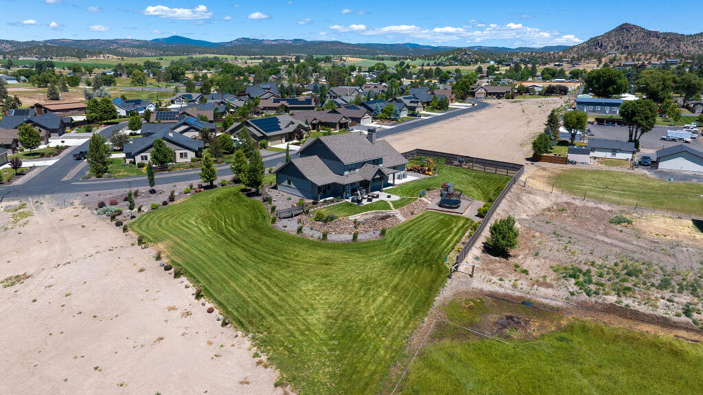 344 Northwest Saddle Ridge Loop Prineville, OR 97754 - Photo 16 of 64 an aerial view of a house with a garden