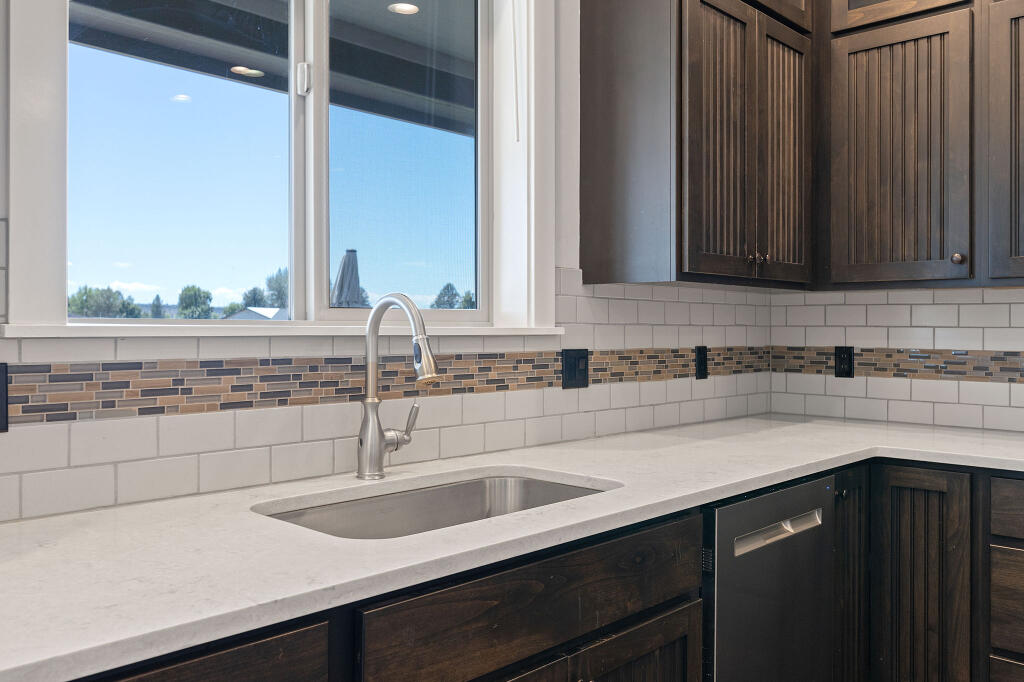 344 Northwest Saddle Ridge Loop Prineville, OR 97754 - Photo 32 of 64 a kitchen with a sink and a window