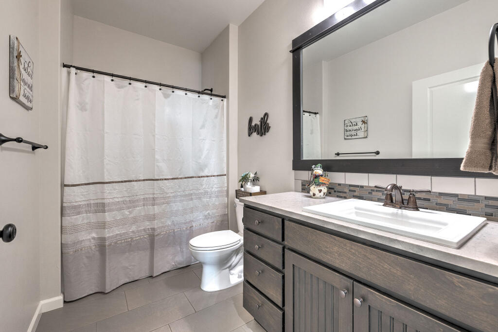 344 Northwest Saddle Ridge Loop Prineville, OR 97754 - Photo 49 of 64 a bathroom with a sink and a mirror