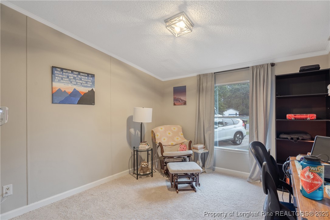 54 West Tryon Court Spring Lake, NC 28390 - Photo 28 of 43 a view of a workspace with furniture and a bedroom