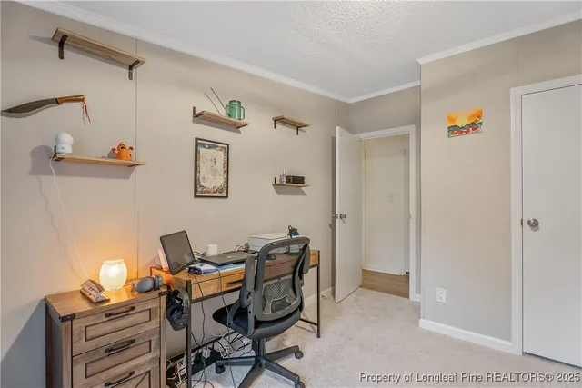 a work room with furniture and rug