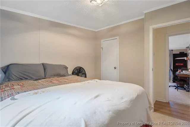 a bed room with a bed and a book shelf