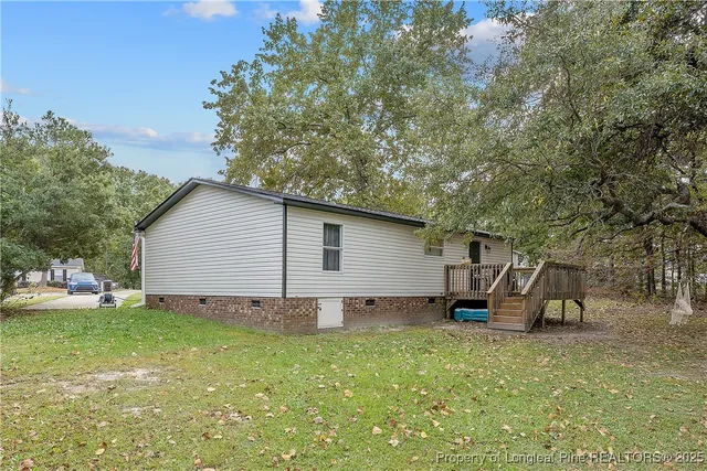 a view of backyard with a table and chairs