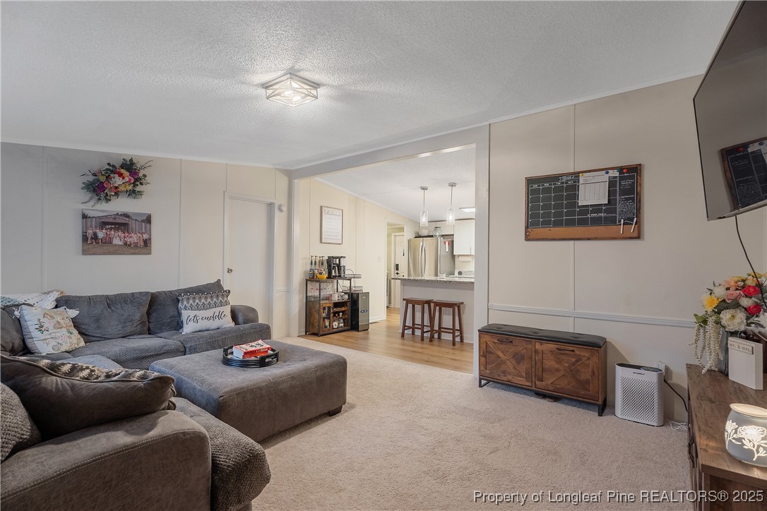 54 West Tryon Court Spring Lake, NC 28390 - Photo 6 of 43 a living room with furniture and a couch