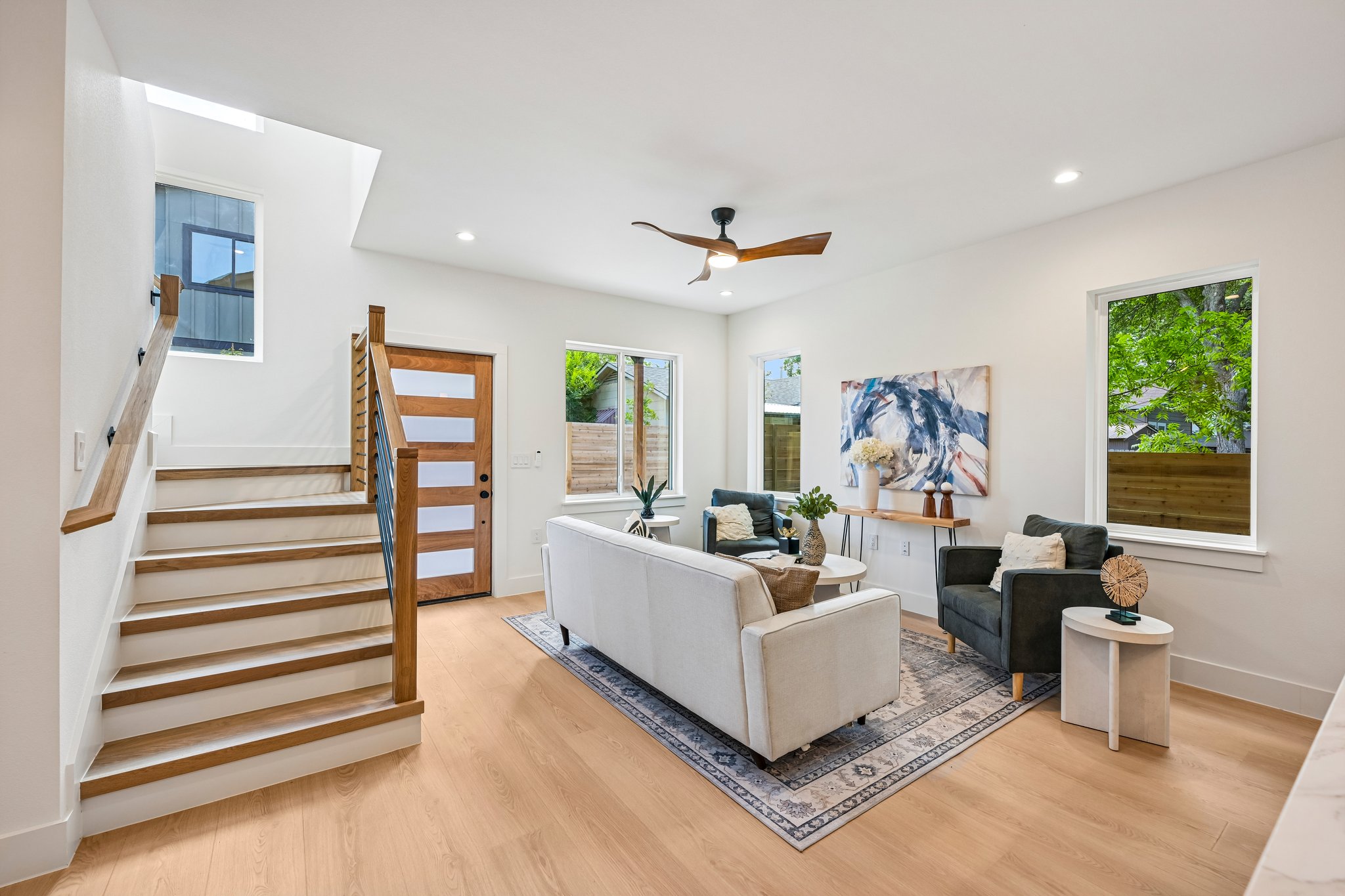 513 West Odell Street, Unit B Austin, TX 78752 - Photo 6 of 38 Naturally illuminated living space with high ceilings and light wood-based laminate flooring.