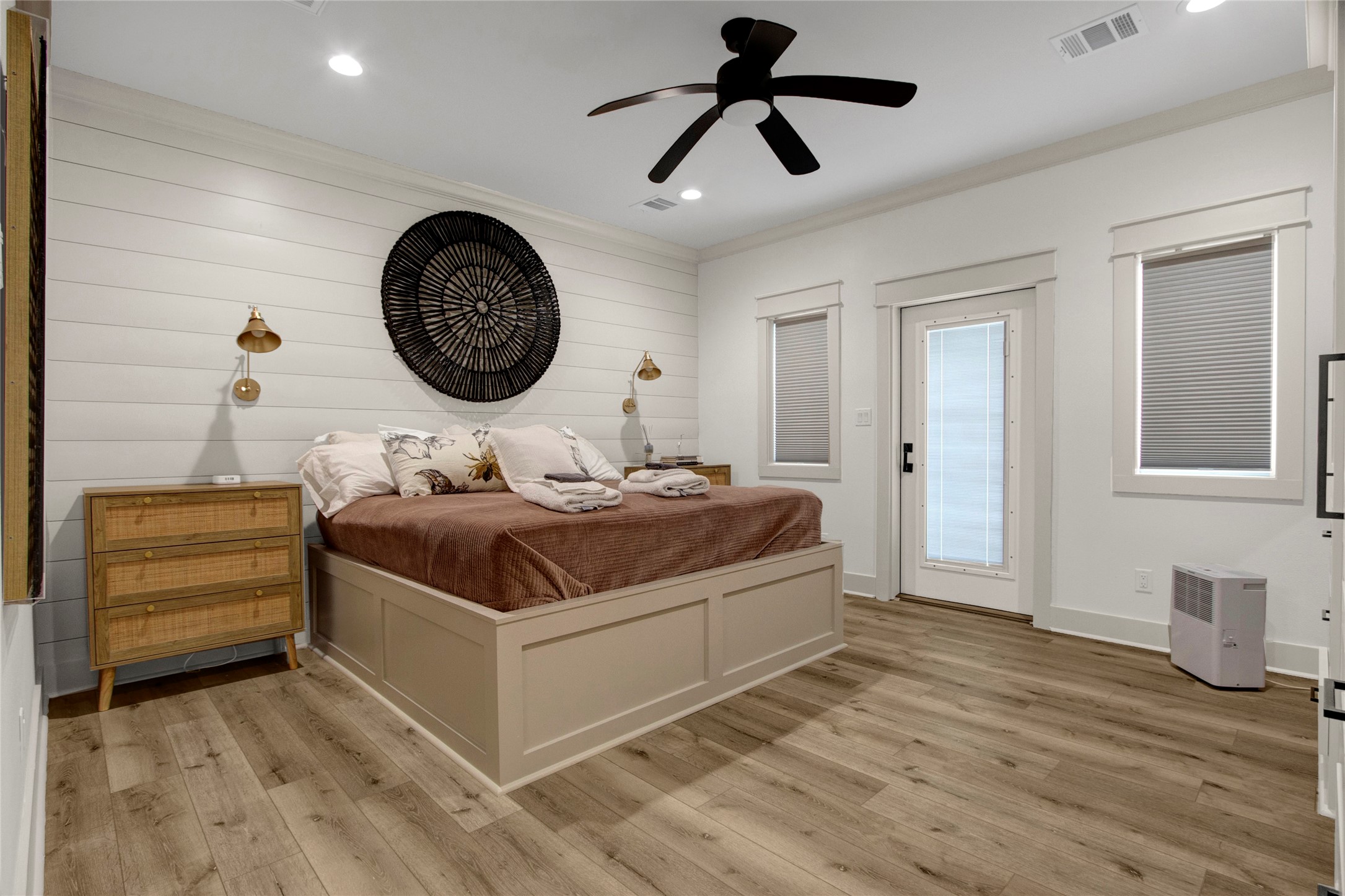 2906 Shady Lane Crystal Beach, TX 77650 - Photo 11 of 35 a bedroom with a bed and a chandelier