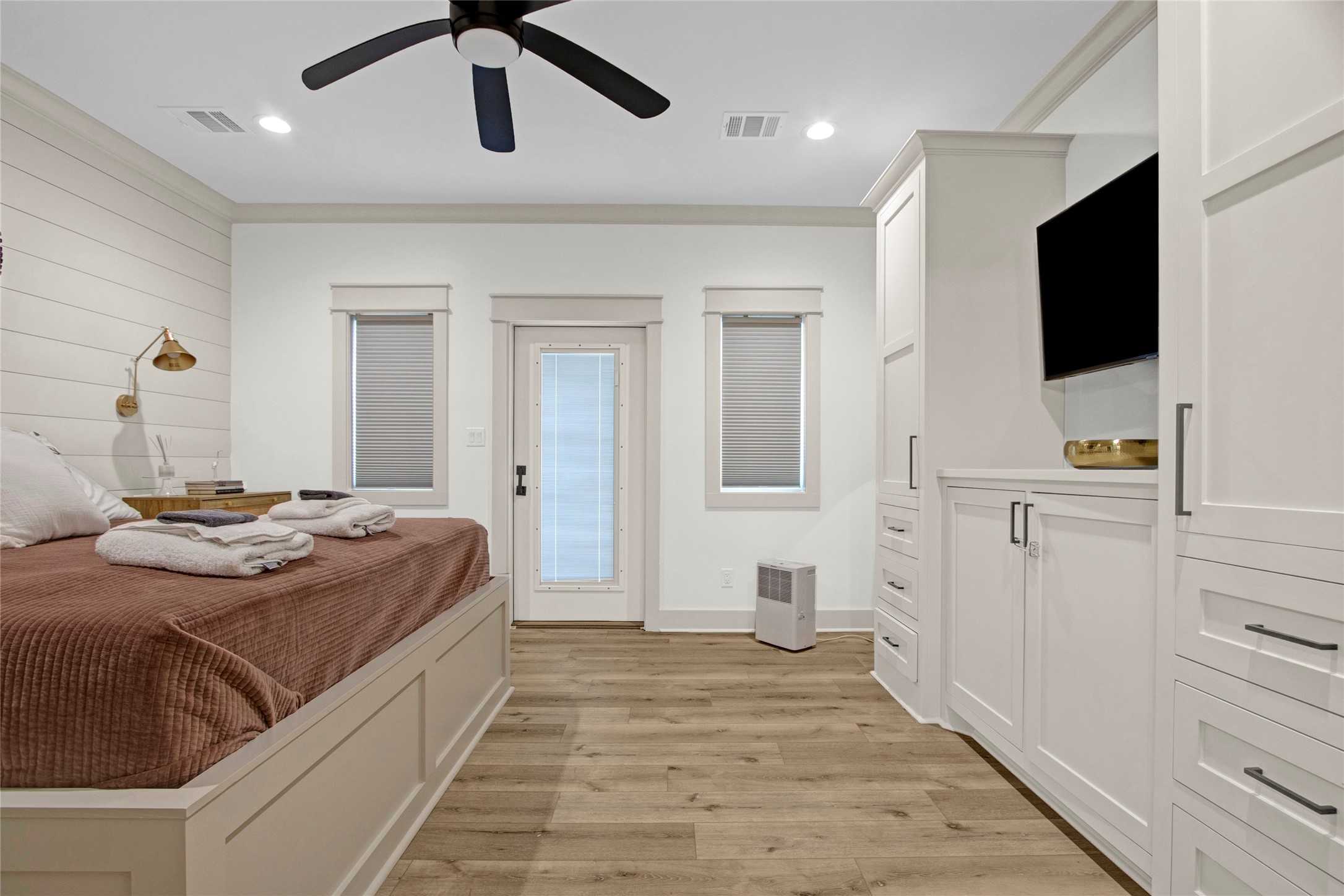 2906 Shady Lane Crystal Beach, TX 77650 - Photo 13 of 35 a bedroom with a bed and a flat screen tv