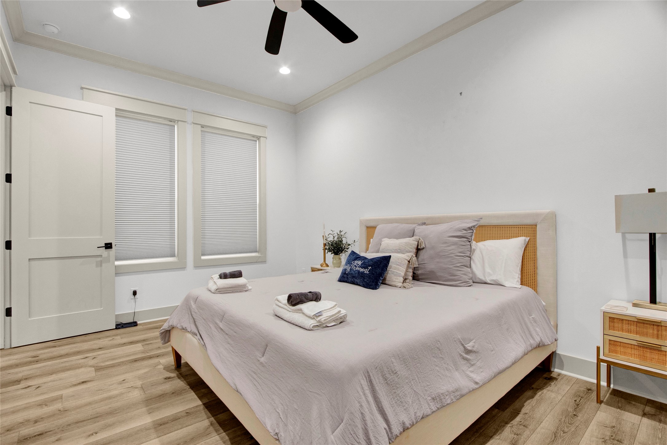 2906 Shady Lane Crystal Beach, TX 77650 - Photo 16 of 35 a bedroom with a bed and wooden floor