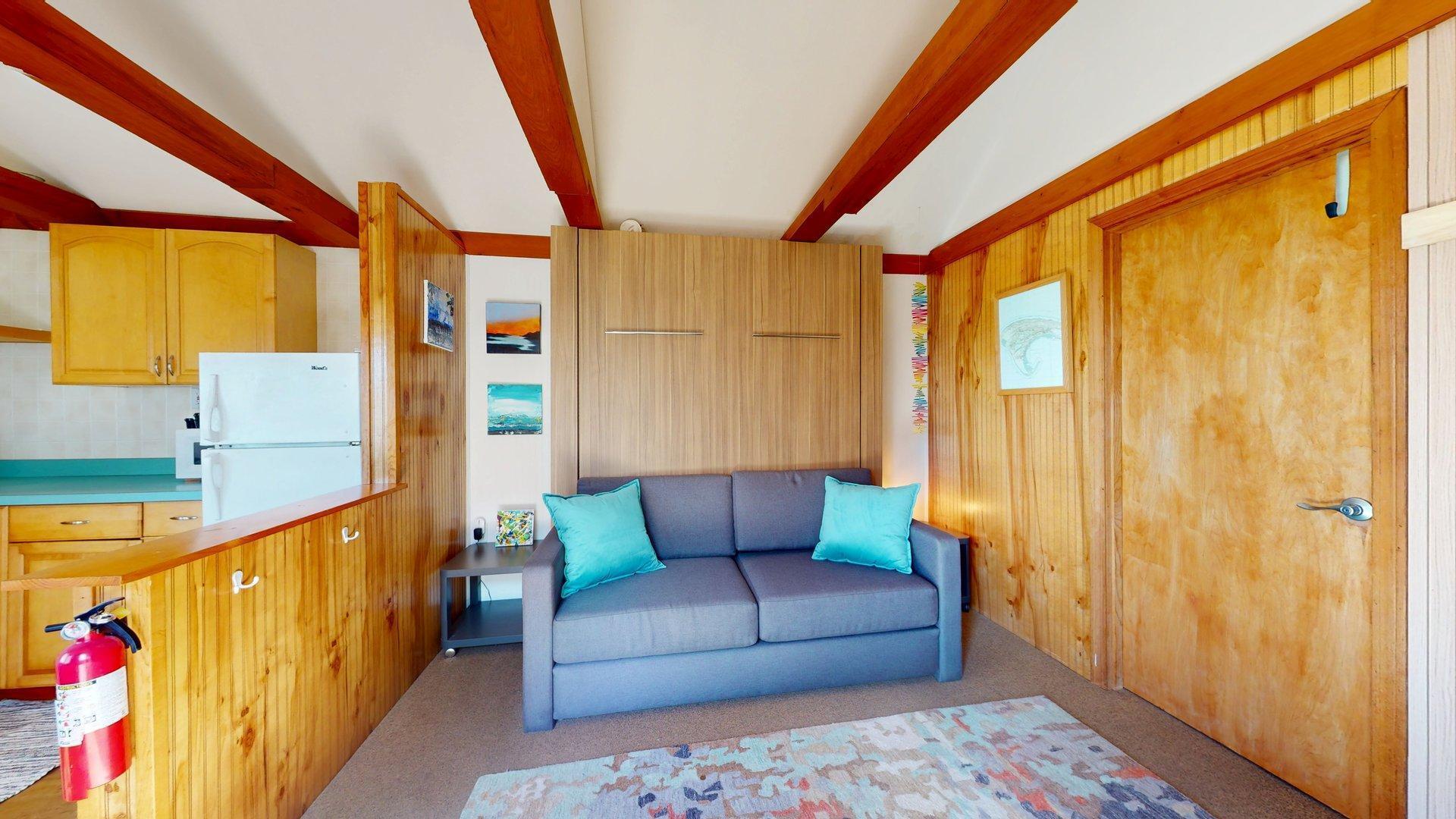 168 Shore Road, Unit 9 Truro, MA 02666 - Photo 13 of 33 a living room with furniture and a window