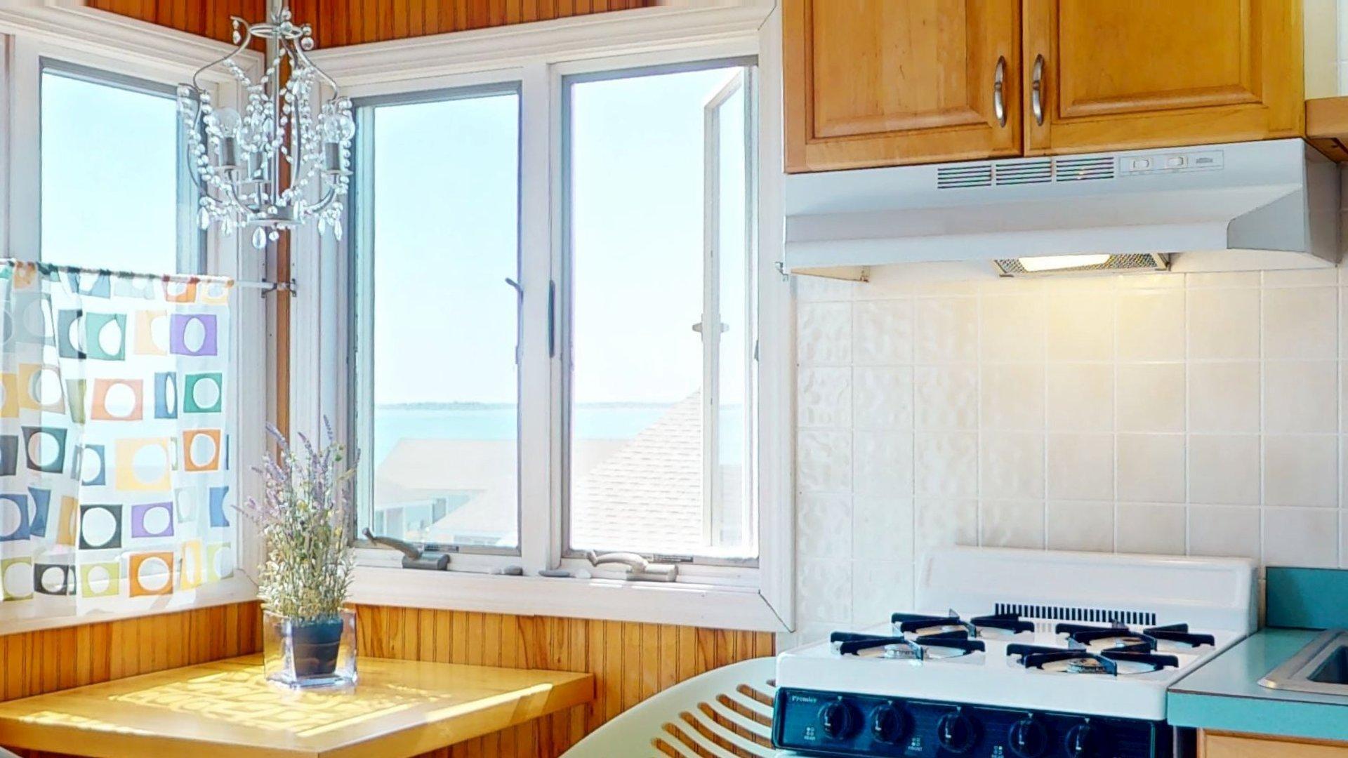 168 Shore Road, Unit 9 Truro, MA 02666 - Photo 16 of 33 a bathroom with a tub a sink and a window