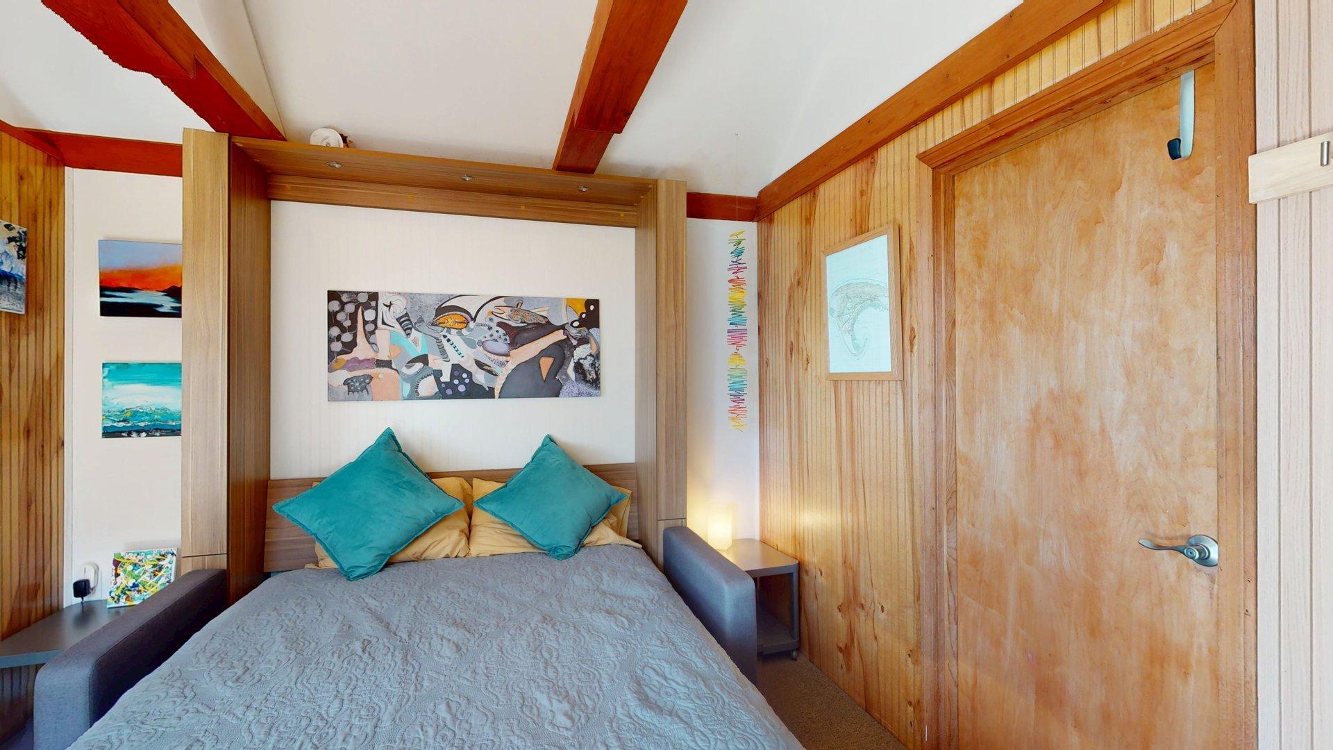 168 Shore Road, Unit 9 Truro, MA 02666 - Photo 23 of 33 a bedroom with a large bed and a window