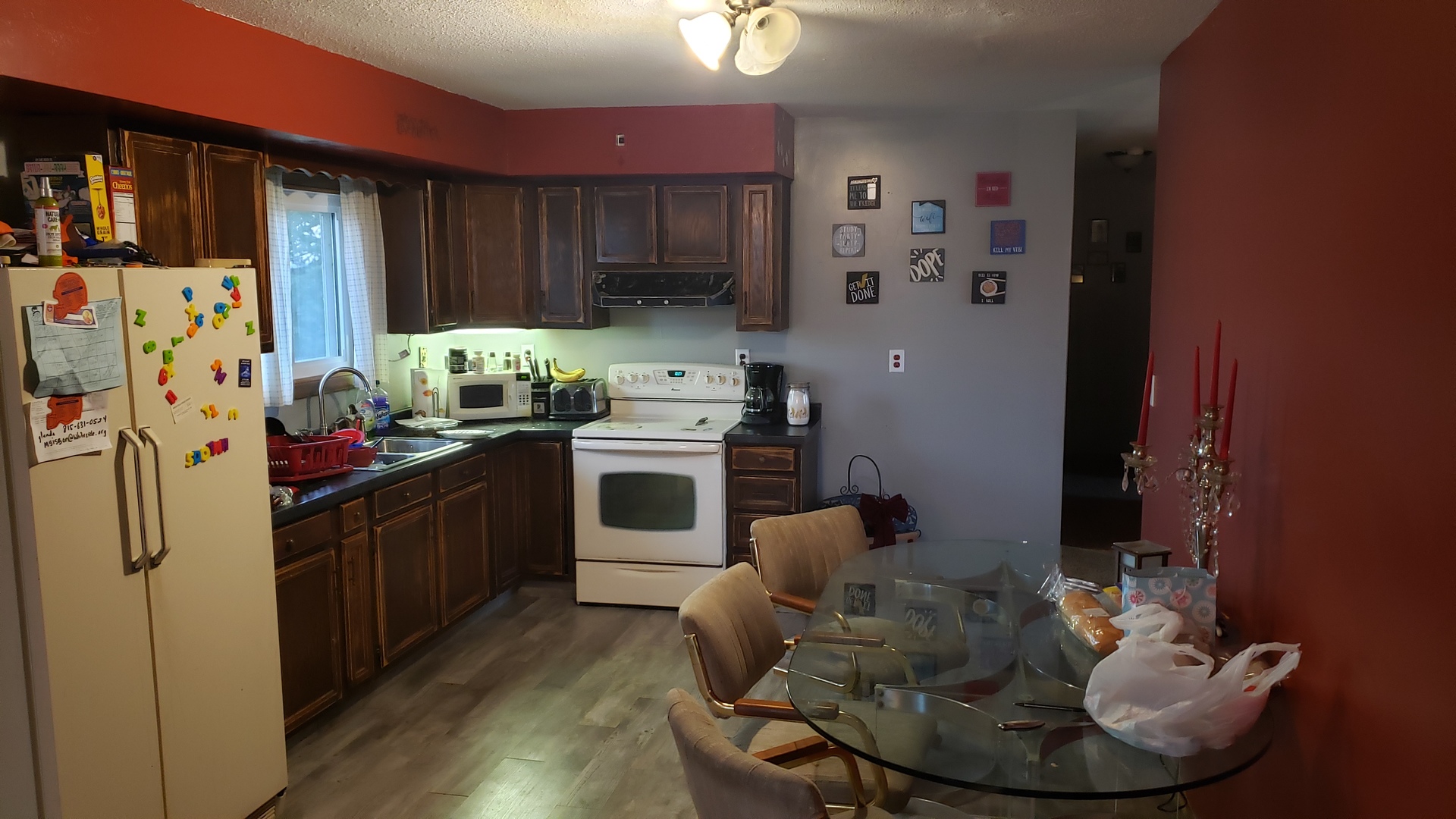 28915 Bell Road Rock Falls, IL 61071 - Photo 4 of 16 a kitchen with stainless steel appliances granite countertop a refrigerator a stove a sink and dishwasher with wooden floor