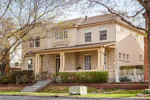 front view of a house with a fountain