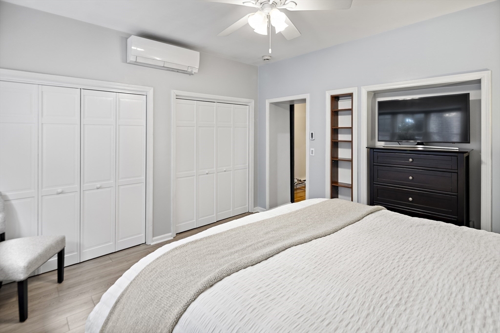 41 Warren Avenue, Unit 1 Boston, MA 02116 - Photo 16 of 20 a bedroom with a bed and a flat screen tv