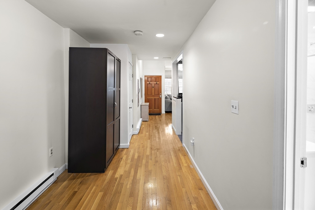 41 Warren Avenue, Unit 1 Boston, MA 02116 - Photo 17 of 20 a view of hallway with wooden floor