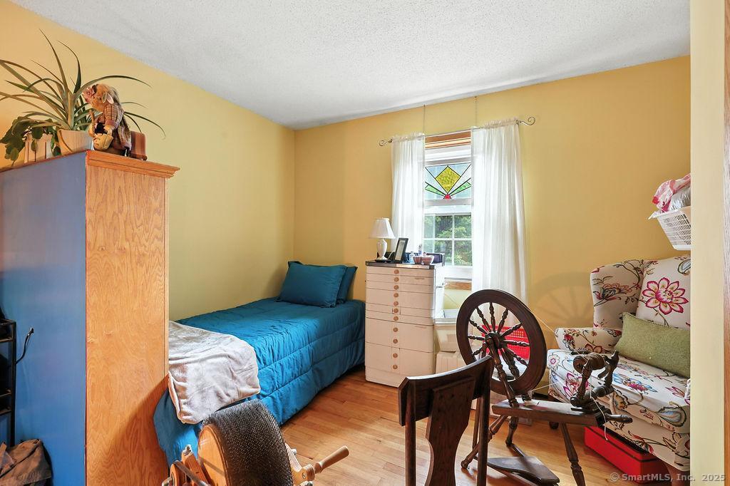 186 Mill Street Hartland, CT 06091 - Photo 15 of 33 a bedroom with a bed and a window