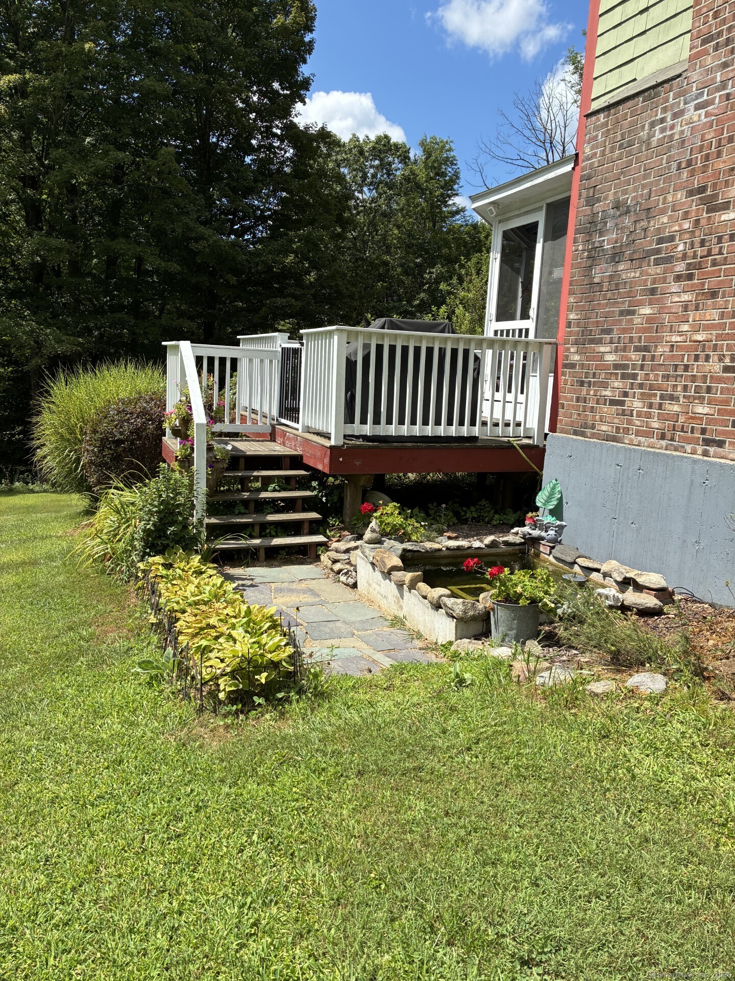 186 Mill Street Hartland, CT 06091 - Photo 30 of 33 a view of a chair and table in the garden
