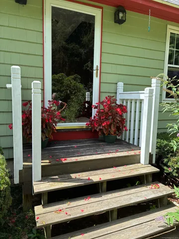 a view of sitting area in front of house