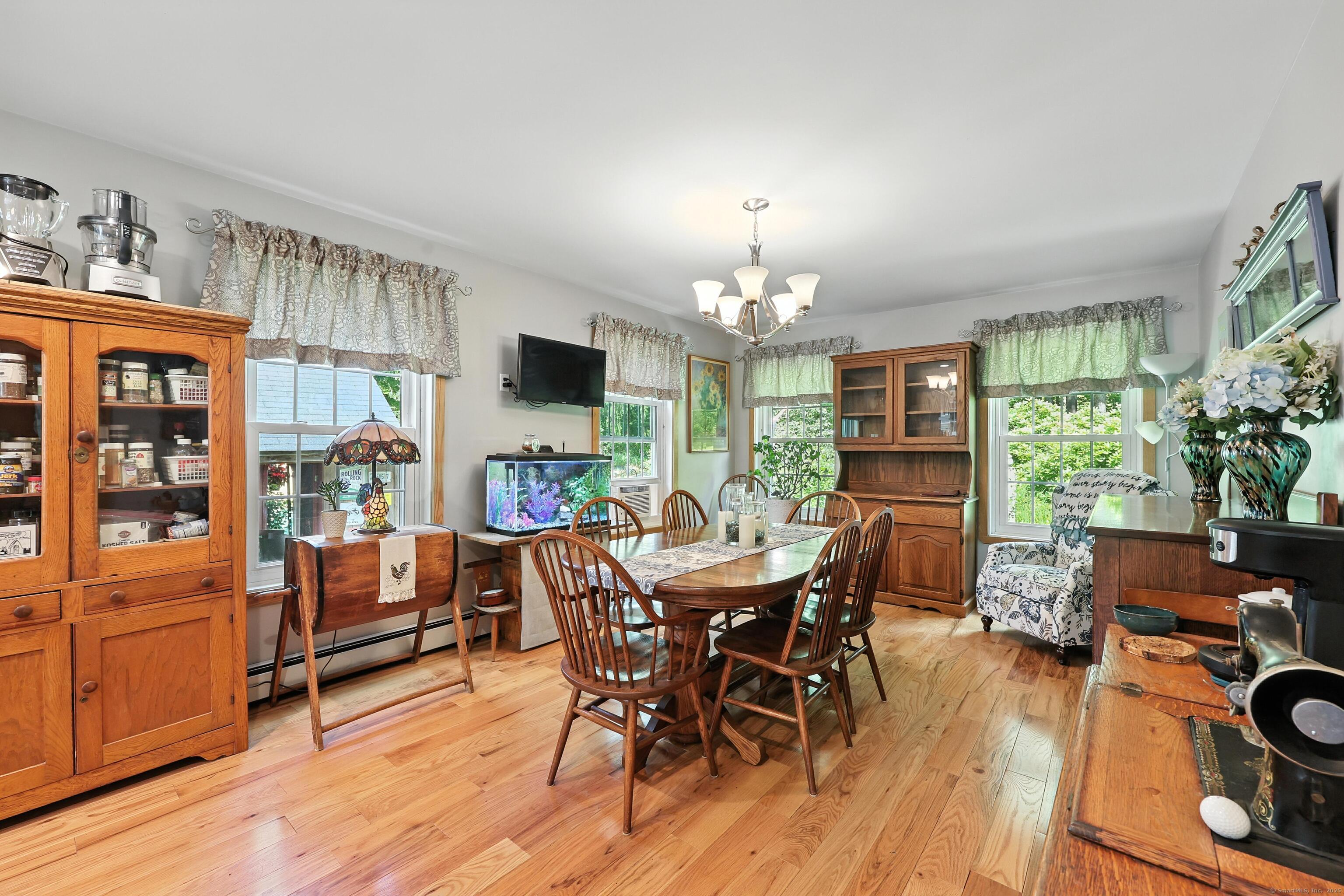 186 Mill Street Hartland, CT 06091 - Photo 8 of 33 a view of a dining room with furniture window and wooden floor