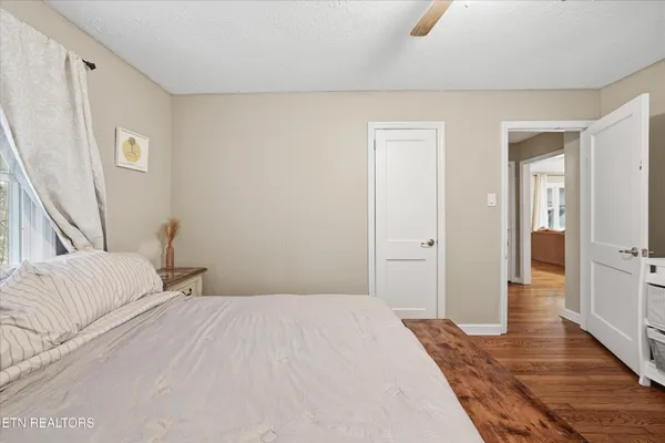 a bedroom with a bed and a mirror