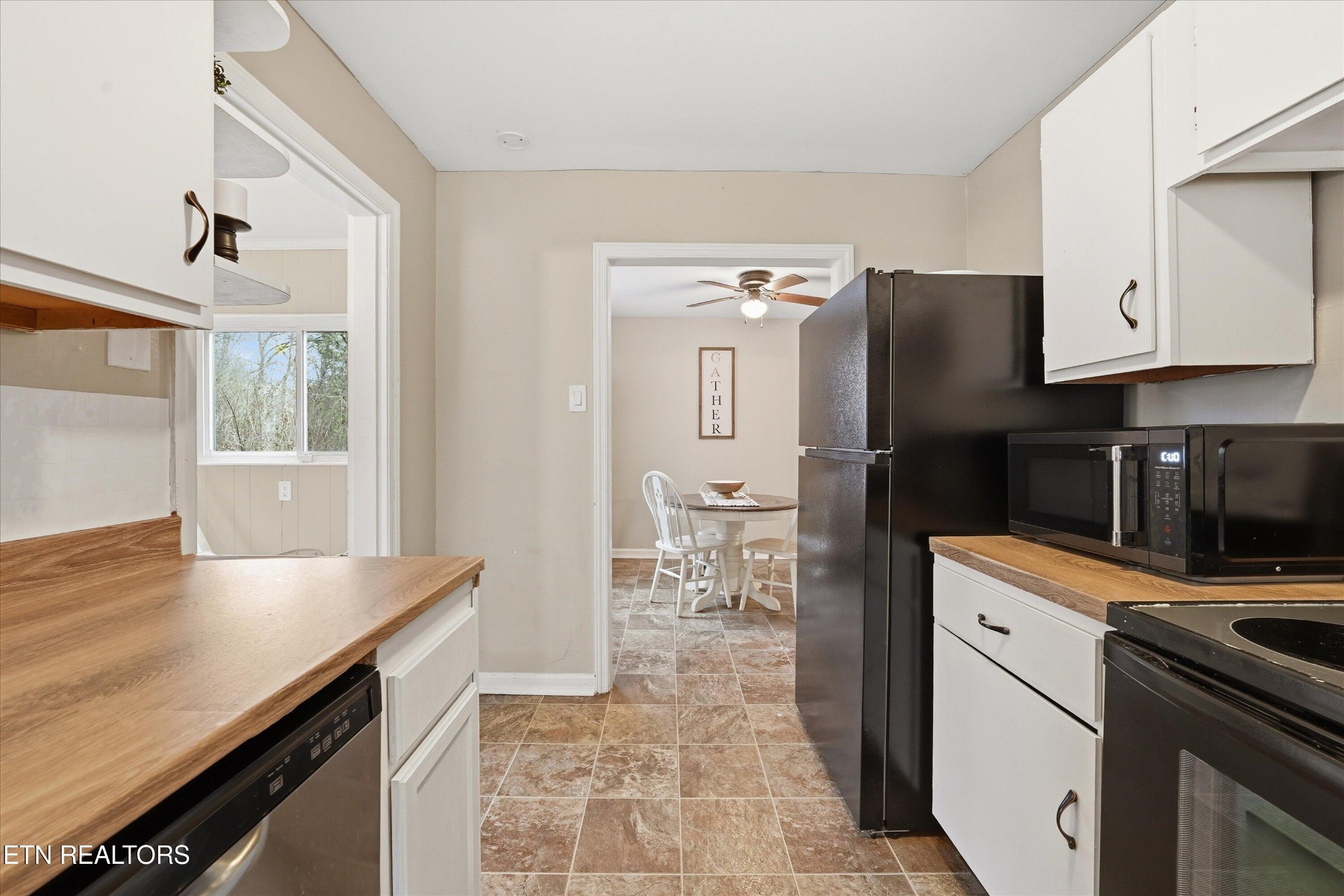 119 Old State Circle Powell, TN 37849 - Photo 17 of 27 a kitchen with granite countertop a refrigerator stove and sink