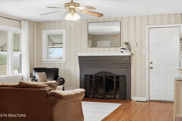 a living room with furniture and a fireplace