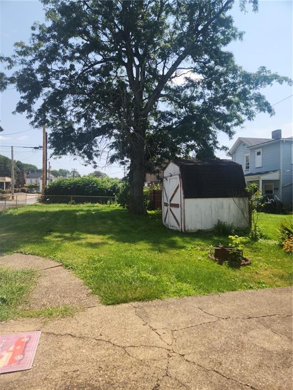 307 North 3rd Street Apollo, PA 15613 - Photo 16 of 17 a backyard of a house with plants and large trees