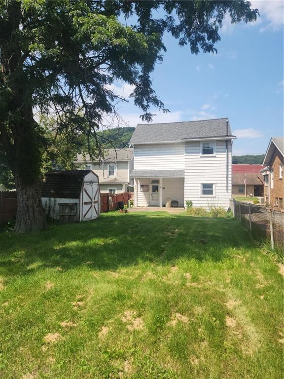 307 North 3rd Street Apollo, PA 15613 - Photo 17 of 17 a front view of a house with a yard and a large tree